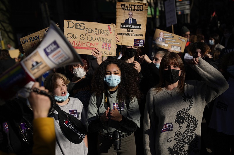 Students and teachers march during a protest in Marseille, southern France, Thursday, Jan. 13, 2022. French teachers have walked out in a nationwide strike Thursday to express anger at the way the government is handling the virus situation in schools, denouncing confusing rules and calling for more protection. (AP Photo/Daniel Cole)