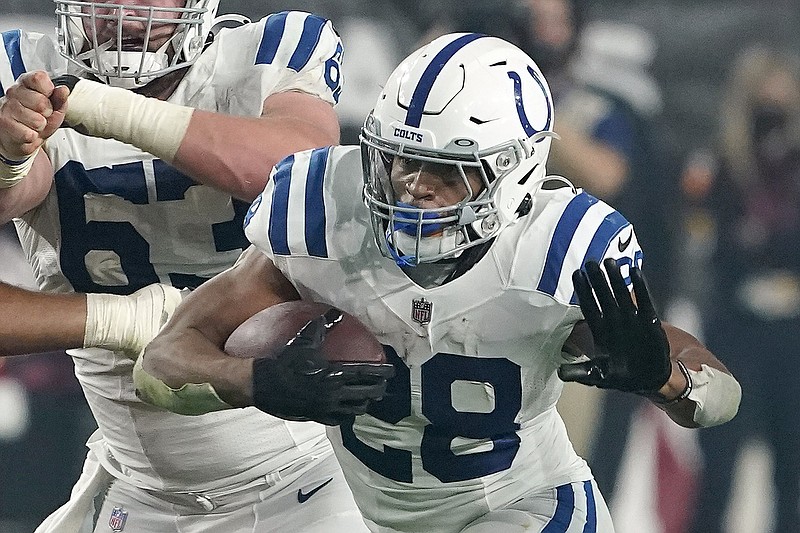FILE -  Indianapolis Colts running back Jonathan Taylor (28) plays against the Arizona Cardinals during an NFL football game on Dec. 25, 2021, in Glendale, Ariz. Taylor was named to The Associated Press 2021 NFL All-Pro Team, announced Friday, Jan. 14, 2022.(AP Photo/Darryl Webb, File)
