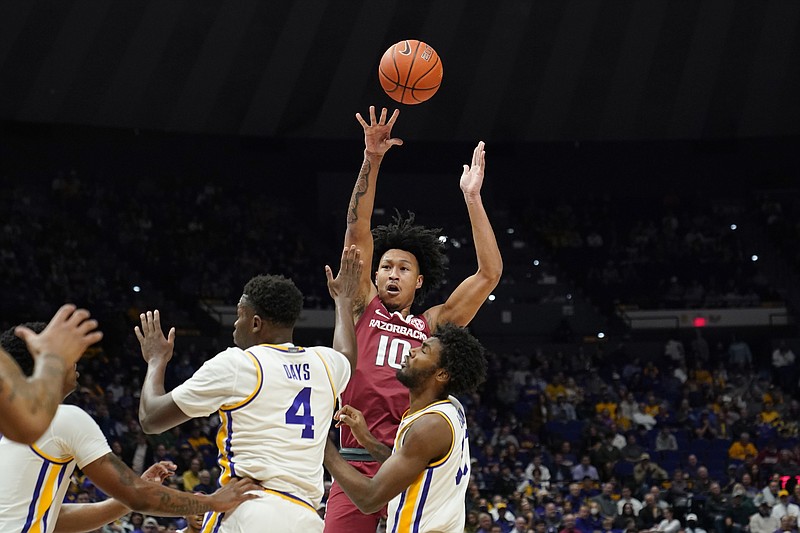 Arkansas forward Jaylin Williams (10) shoots over LSU forward Darius Days (4) in the first half of an NCAA basketball game in Baton Rouge, La., Saturday. – Photo by Gerald Herbert of The Associated Press