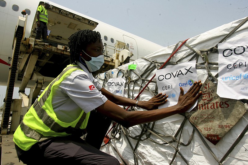 FILE - A shipment of COVID-19 vaccines distributed by the COVAX Facility arrives in Abidjan, Ivory Coast, Friday Feb. 25, 2021. The World Health Organization says a U.N.-backed program shipping coronavirus vaccines to many poor countries has now delivered 1 billion doses, but that milestone &#x201c;is only a reminder of the work that remains&#x201d; after hoarding and stockpiling in rich countries. The U.N. health agency said Sunday, Jan. 16, 2022 that a shipment of 1.1 million COVID-19 vaccine doses to Rwanda this weekend included the billionth dose supplied via the COVAX program. (AP Photo/Diomande Ble Blonde, File)
