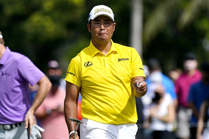 Hideki Matsuyama, of Japan, reacts after saving par on the first green during the final round of the Sony Open golf tournament, Sunday, Jan. 16, 2022, at Waialae Country Club in Honolulu. (AP Photo/Matt York)