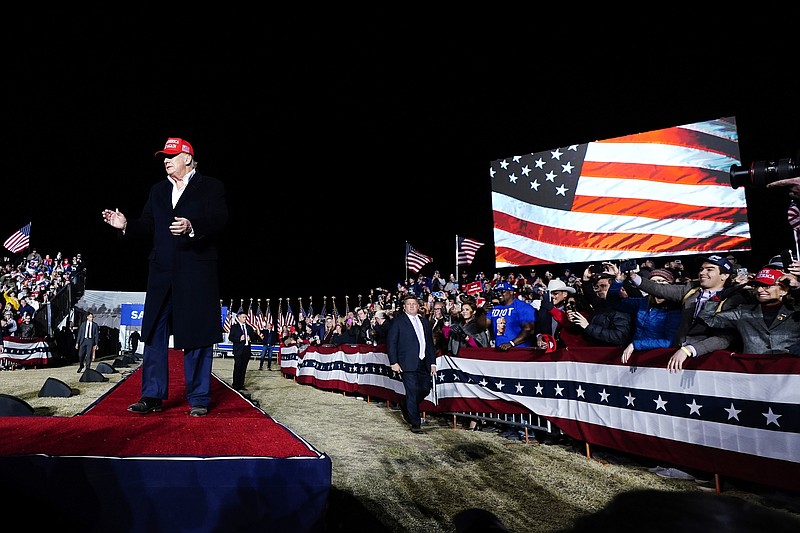 Former President Donald Trump reacts to the crowd prior to speaking at a Save America Rally Saturday, Jan. 15, 2022, in Florence, Ariz. (AP Photo/Ross D. Franklin)