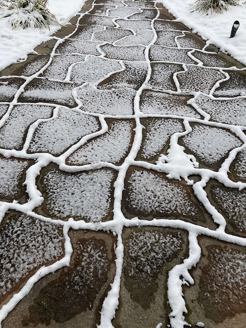 Devin Houston/Write On
Snow covers the walk way, leaving some slippery footing &#x2014;&#xa0;nature's way of giving us a &quot;time out.&quot;