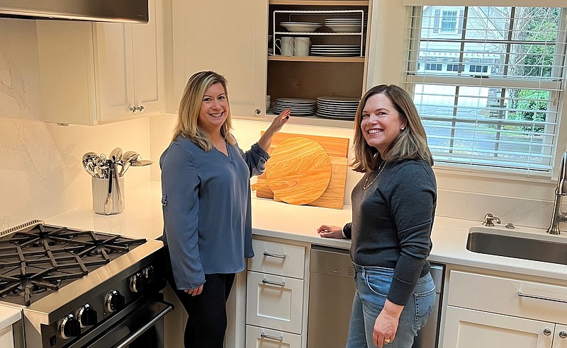 Professional organizer Dani Tanner Liu, left, stands with long-time client Jennifer McCarthy, in McCarthy’s well-organized kitchen, in Lake Oswego, Ore. (Courtesy of Totally Orderly)