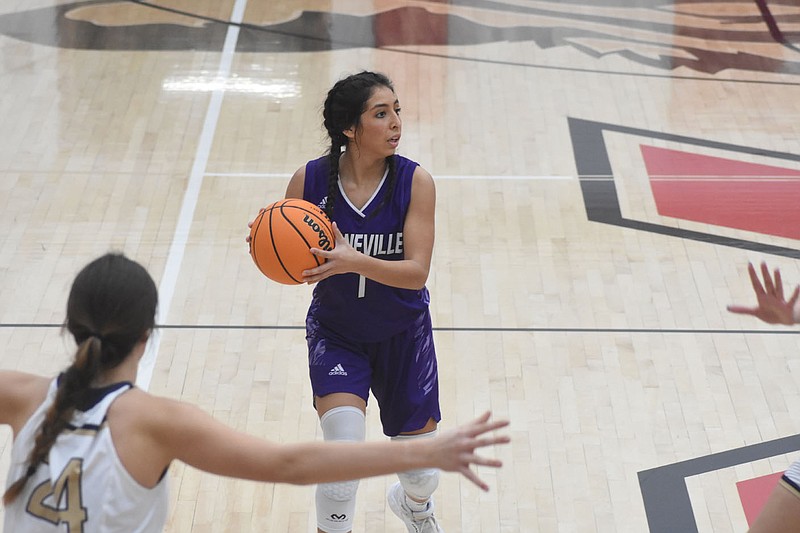 Heaven Sanchez, a senior guard for the Booneville Lady Bearcats, looks to make a pass during a game this season. Booneville is undefeated at 16-0 and leading the 3A-4 Conference. Sanchez is averaging 14 points and 4 assists for game for the Lady Bearcats this season.
Special to the NWA Democrat-Gazette Glenn Parrish / Booneville Public Schools