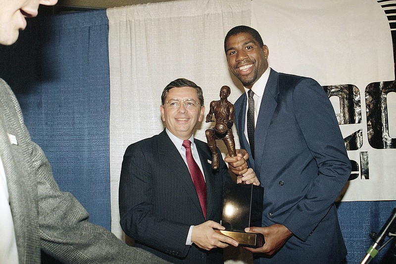 FILE - Earvin &quot;Magic&quot; Johnson breaks stands with David Stern, commissioner of the National Basketball Association, May 18, 1987, at the Forum in Inglewood, Calif., after Johnson was named the NBA's Most Valuable Player for 1986-87 season. (AP Photo/Alison Wise, File)