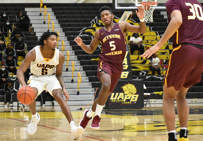 DeQuan Morris of UAPB tries to shake off Damani McEntire (5) of Bethune-Cookman in the second half Monday, Jan. 17, 2022, at H.O. Clemmons Arena. (Pine Bluff Commercial/I.C. Murrell)