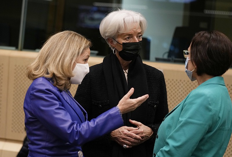 Spain's Economy Minister Nadia Calvino, left, speaks with Luxembourg's Finance Minister Yuriko Backes, right, and European Central Bank President Christine Lagarde during a meeting of eurogroup finance ministers at the European Council building in Brussels, Monday, Jan. 17, 2022. Euro finance chiefs hold their first meeting of 2022 in Brussels today facing a challenge that spilled over from last year: surging prices. Inflation in the 19-nation euro area has risen to a record amid an energy-market squeeze while the economic outlook for Europe has dimmed following a recovery in 2021 from the pandemic-induced recession. (AP Photo/Virginia Mayo)