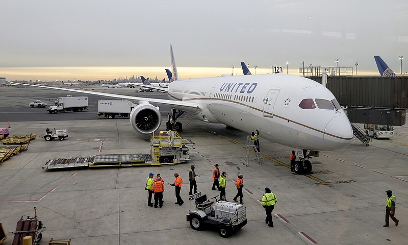 FILE - A Dreamliner 787-10 arriving from Los Angeles pulls up to a gate at Newark Liberty International Airport in Newark, N.J., Monday, Jan. 7, 2019. (AP Photo/Seth Wenig, File)