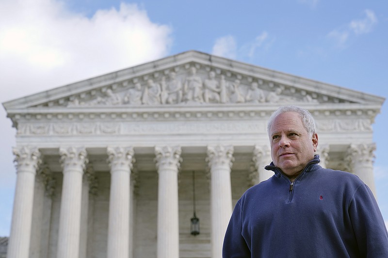 David Cassirer, the great-grandson of Lilly Cassirer, poses for a photo outside the Supreme Court in Washington, Tuesday, Jan. 18, 2022. Lilly Cassirer surrendered her family's priceless Camille Pissarro painting to the Nazis in exchange for safe passage out of Germany during the Holocaust. The Supreme Court is hearing the case about the stolen artwork now in the collection of a Spanish museum in Madrid. (AP Photo/Susan Walsh)