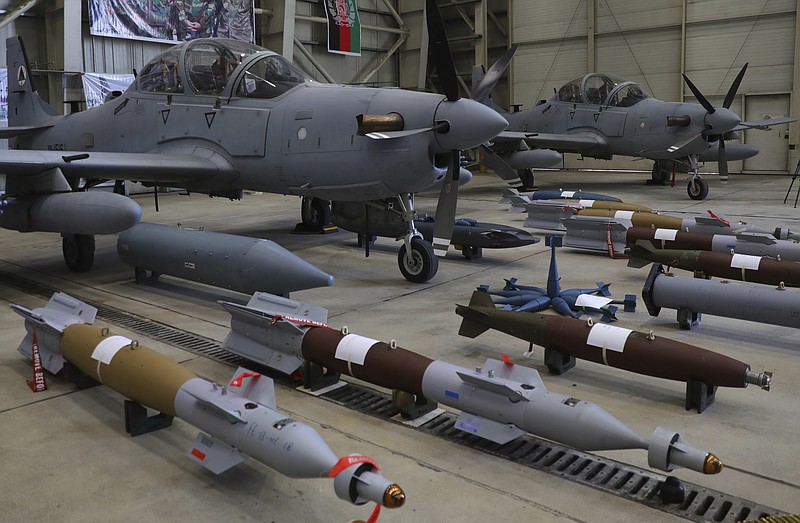 FILE - A-29 Super Tucano planes and munitions are on display during a handover from the NATO-led Resolute Support mission to the Afghan army at the military Airport in Kabul, Afghanistan, Sept. 17, 2020. A year-old report by Washington&#x2019;s Afghanistan watchdog warned in early 2021, months before President Joe Biden announced the end to America&#x2019;s longest war, the Afghan air force would collapse without critical U.S. aid, training and American maintenance. The report by the Special Inspector General for Afghanistan Reconstruction John Sopko was classified back when it was written and only declassified on Tuesday, Jan. 18, 2021. (AP Photo/Rahmat Gul, File)