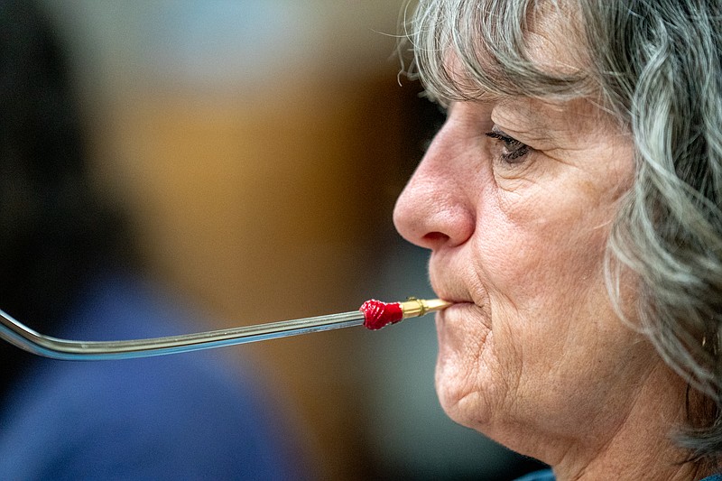 Ethan Weston/News Tribune Barb Henry plays bassoon during Jefferson City Community Band practice on Tuesday, Feb. 8, 2022 at Helias Catholic High School in Jefferson City, Mo. Henry has been playing bassoon since 7th grade.