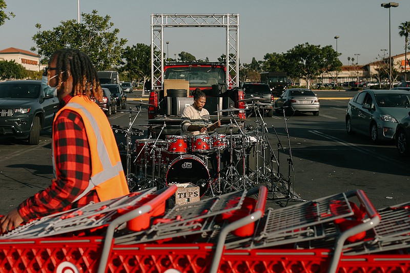 Anthony Sheriff, stage name Sheriff Drumman, a South Central drummer performs in the Target parking lot on Wednesday, Jan. 5, 2022, in Inglewood, California. (Jason Armond/Los Angeles Times/TNS)