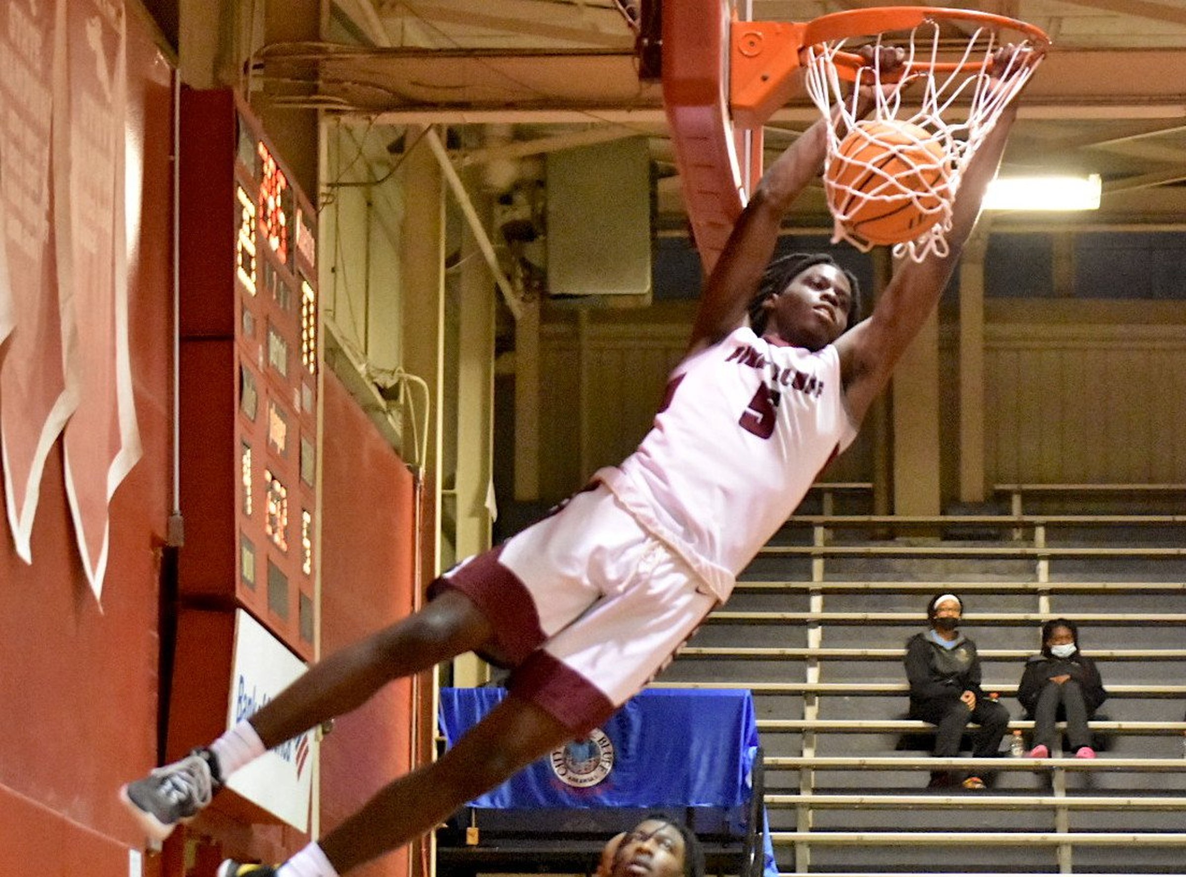 Zebras step on the gas, overcome Trojans 60-56