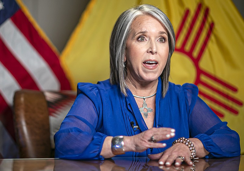 New Mexico Gov. Michelle Lujan Grisham delivers the State of the State address during the 56th legislative session Tuesday, Jan. 18, 2022, in Santa Fe, N.M. Her State of the State address was delivered live but remote from her office as lawmakers gathered in their chambers at the state capitol. (Jim Weber/Santa Fe New Mexican via AP, Pool)