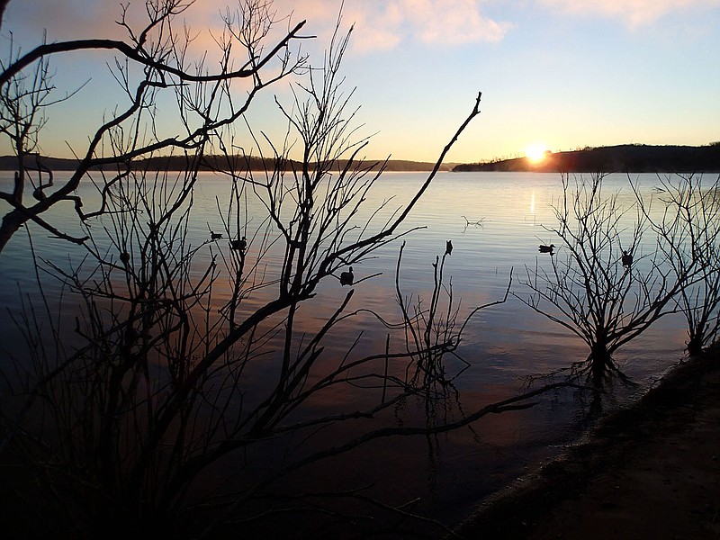 Sunrise shines on a spread of decoys Jan. 10 2022 during a duck hunt at Beaver Lake. Northwest Arkansas offers ample opportunity to hunt waterfowl with a shotgun, camera or binoculars during winter. 
(NWA Democrat-Gazette/Flip Putthoff)