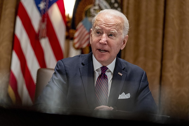 President Joe Biden meets with members of the Infrastructure Implementation Task Force to discuss the Bipartisan Infrastructure Law, in the Cabinet Room at the White House in Washington, Thursday, Jan. 20, 2022. (AP Photo/Andrew Harnik)