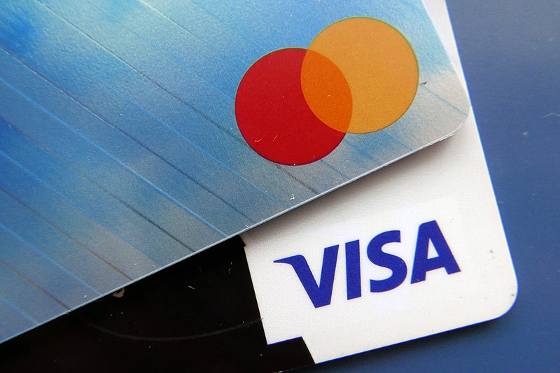 Credit cards as seen Thursday, July 1, 2021, in Orlando, Fla.  Paying for gifts, travel, entertaining and other holiday expenses has caused many of us to start off the new year in debt. The sooner you create a plan, the sooner you can leave that debt behind.  (AP Photo/John Raoux)