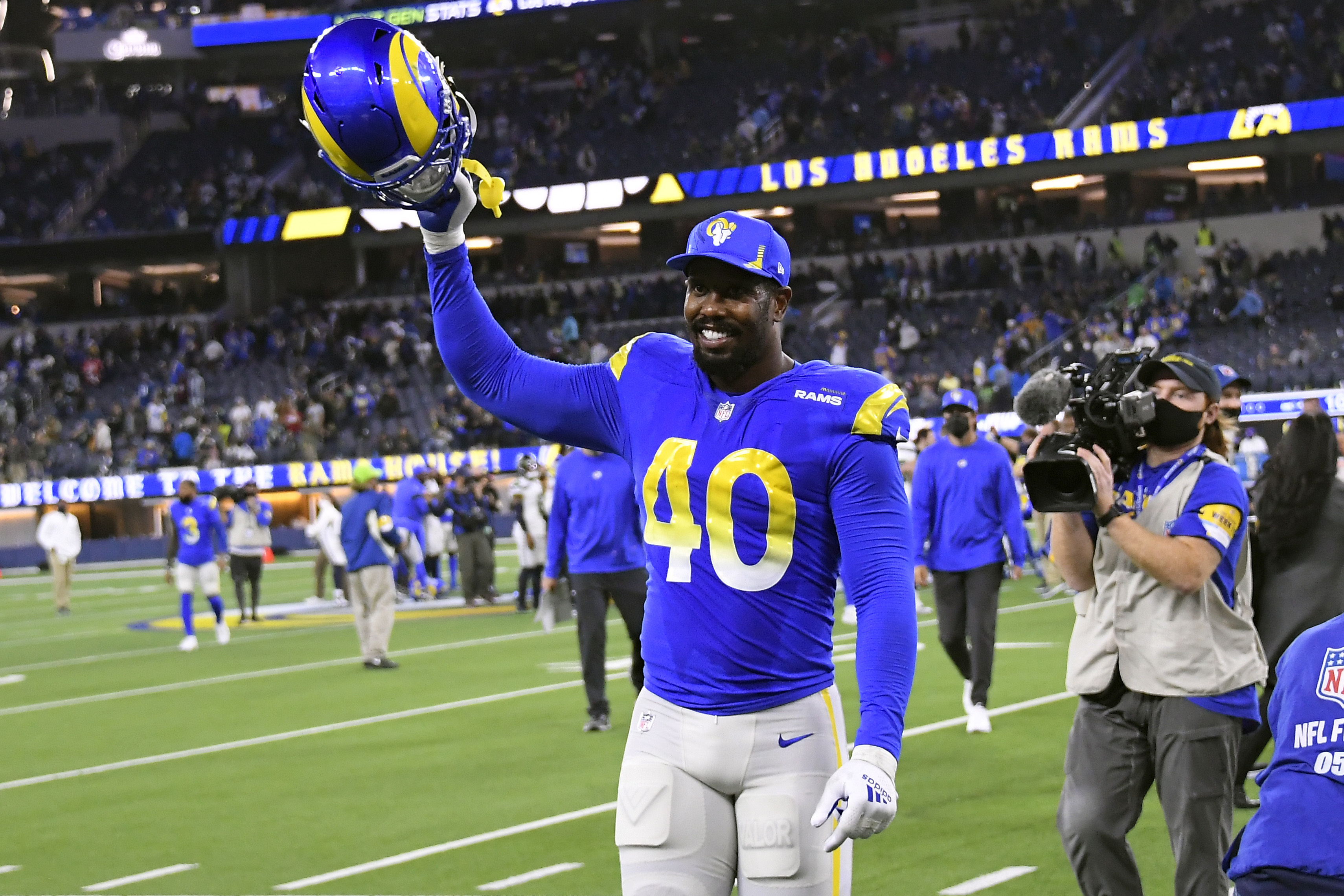 Los Angeles Rams linebacker Von Miller, defensive tackle Aaron Donald go  WILD in on-field interview after NFC title win over San Francisco 49ers