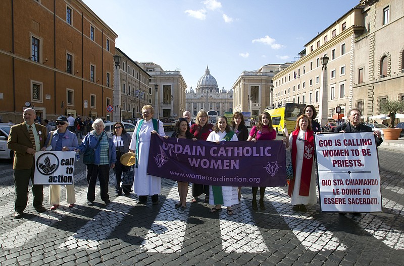 Members of the Women's Ordination Conference group stage a protest in front of St. Peter's Basilica, in Rome, on Oct. 17, 2011. The Vatican has included a group that advocates for women&#x2019;s ordination on a website promoting its two-year consultation of rank-and-file Catholics in the latest sign that Pope Francis wants to hear from all Catholics during the process. The Women&#x2019;s Ordination Conference has launched a &#x201c;Let Her Voice Carry&#x201d; campaign in conjunction with the Vatican&#x2019;s 2023 &#x201c;synod&#x201d; or gathering of the world&#x2019;s bishops. In the run-up to the meeting, the Vatican has asked dioceses, religious orders and other Catholic groups to embark on listening sessions to hear from ordinary Catholics about their needs. (AP Photo/Andrew Medichini, File)