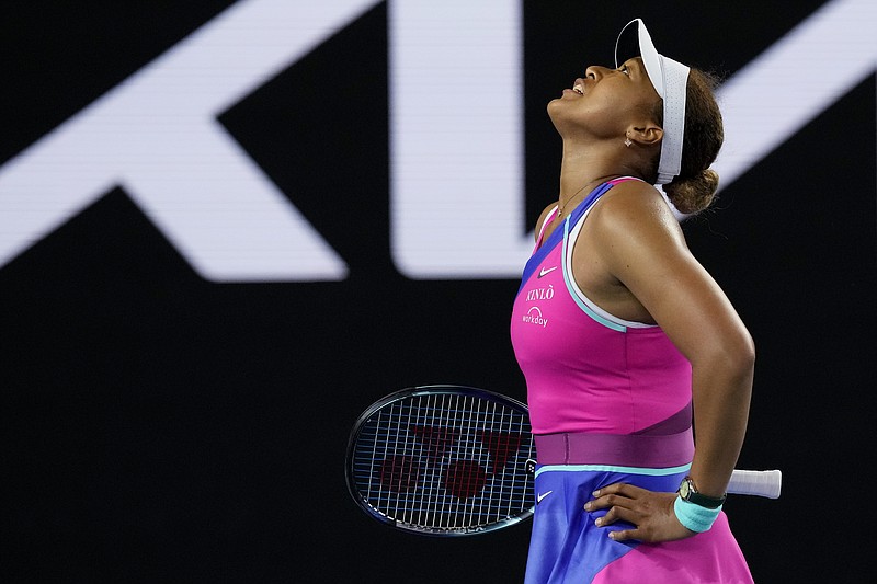 Naomi Osaka of Japan reacts during her third round match against Amanda Anisimova of the U.S. at the Australian Open tennis championships in Melbourne, Australia, Friday, Jan. 21, 2022. (AP Photo/Simon Baker)