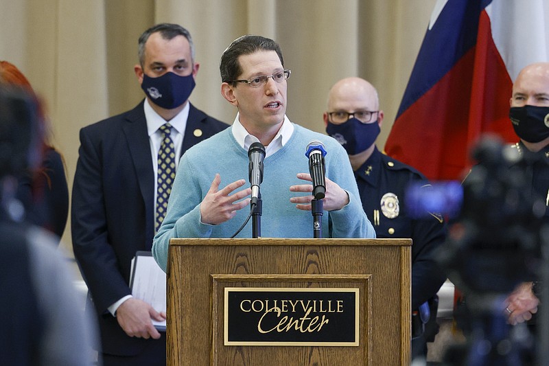 Rabbi Charlie Cytron-Walker of Congregation Beth Israel addresses reporters during a news conference at Colleyville Center on Friday, Jan. 21, 2022 in Colleyville, Texas. In the final moments of a 10-hour standoff with a gunman at a Texas synagogue, the remaining hostages and officials trying to negotiate their release took &#x201c;near simultaneous plans of action,&#x201d; with the hostages escaping as an FBI tactical team moved in, an official said Friday. (Elias Valverde II/The Dallas Morning News via AP)