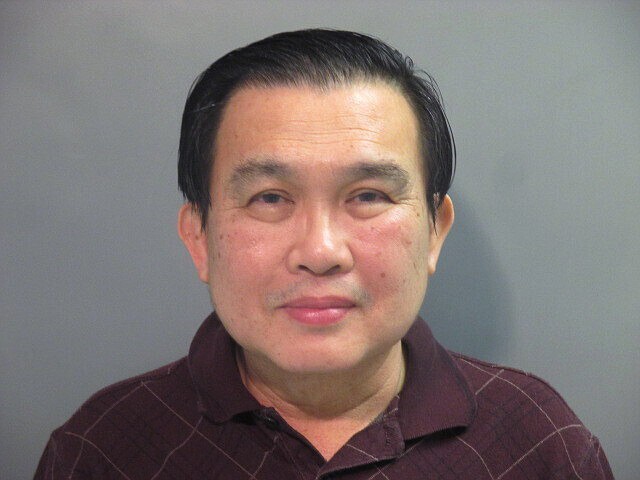 FILE - This undated file photo provided by the Washington County (Ark.) Detention Center shows Simon S. Ang. Ang, a suspended University of Arkansas professor pleaded guilty Friday to lying to the FBI about patents he had for inventions in mainland China. (Washington County Detention Center via AP, File)