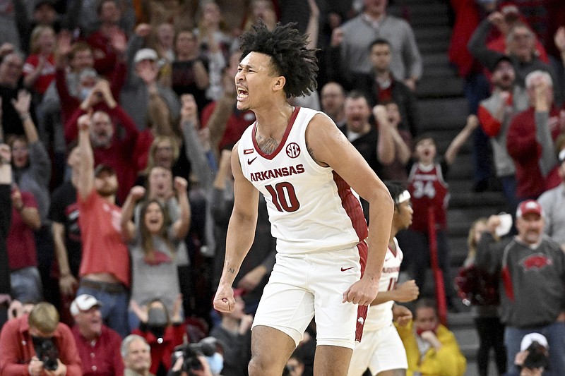 Arkansas forward Jaylin Williams (10) reacts after making a basket against Texas A&amp;M with 7 seconds left during the first overtime period of an NCAA college basketball game Saturday, Jan. 22, 2022, in Fayetteville, Ark. (AP Photo/Michael Woods)