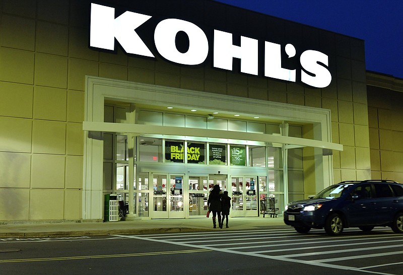 A pair of shoppers arrive at a Kohl's, Nov. 26, 2021, in Everett, Mass. Kohl?s Corp. is confirming that it received letters expressing interest in acquiring the department store chain. The confirmation on Monday, Jan. 24, 2022 follows media reports that Sycamore Partners approached Kohl?s about a potential deal. (AP Photo/Josh Reynolds)