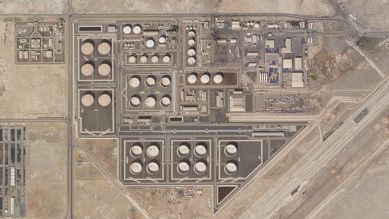 This satellite image provided by Planet Labs PBC shows the aftermath of an attack claimed by Yemen's Houthi rebels on an Abu Dhabi National Oil Co. fuel depot in the Mussafah neighborhood of Abu Dhabi, United Arab Emirates, Saturday, Jan. 22, 2022. The United Arab Emirates intercepted two ballistic missiles targeting Abu Dhabi in a new attack early Monday, Jan. 24, 2022, its state-run news agency reported, the latest attack to target the Emirati capital. No group immediately claimed responsibility but suspicion immediately fell on the Houthis. (Planet Labs PBC via AP)