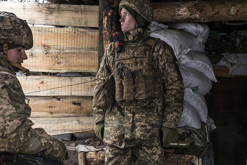 Ukrainian soldiers in a trench on the front line on Monday, Jan. 24, 2022, in Popasna, Ukraine. Given Russia’s penchant for misdirection, it’s unclear how a military incursion would start. And that keeps the Ukrainian troops on edge. (Brendan Hoffman/The New York Times)
