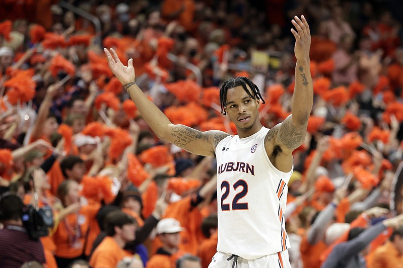 Auburn guard Allen Flanigan (22) reacts after a score during the second half of an NCAA college basketball game against Kentucky Saturday, Jan. 22, 2022, in Auburn, Ala. (AP Photo/Butch Dill)