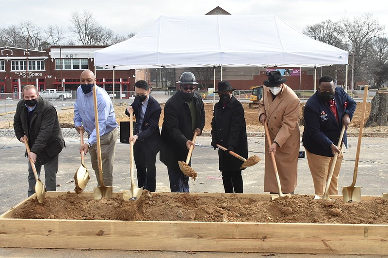 Hart Construction project manager Chad Froud, Friendship Aspire Arkansas Board President Jeff Pulliam, Friendship Aspire Superintendent Phong Tran, Friendship Education Foundation CEO Joe Harris, Pine Bluff Mayor Shirley Washington, Friendship Aspire Academy Founder Donald Hense and Friendship Aspire Academy Pine Bluff Principal Jherrithan Dukes ceremonially break ground on a new campus at 700 Main St., next to the Pine Bluff/Jefferson County Main Library, on Tuesday, Jan. 25, 2022. (Pine Bluff Commercial/I.C. Murrell)