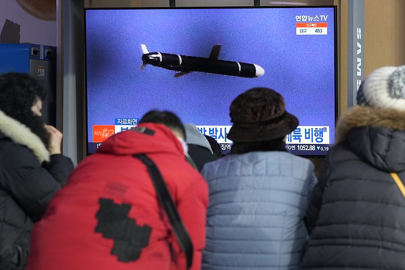 People watch a TV showing a file image of North Korea's missile launch during a news program at the Seoul Railway Station in Seoul, South Korea, Tuesday, Jan. 25, 2022. North Korea on Tuesday test-fired two suspected cruise missiles in its fifth round of weapons launches this month, South Korean military officials said, as it displays its military might amid pandemic-related difficulties and a prolonged freeze in nuclear negotiations with the United States. (AP Photo/Ahn Young-joon)