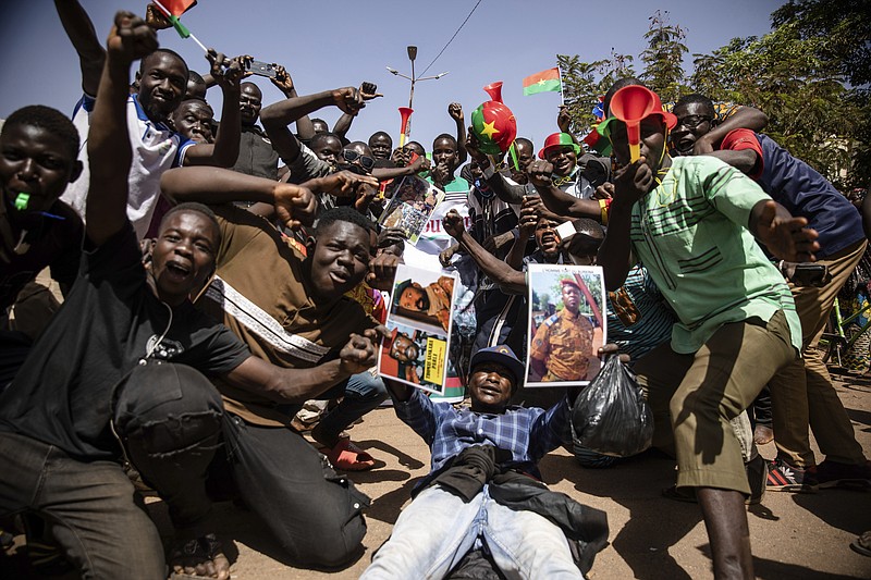 People take to the streets of Ouagadougou, Burkina Faso, Tuesday Jan. 25, 2022 to rally in support of the new military junta that ousted democratically elected President Roch Marc Christian Kabore and seized control of the country.(AP Photo/Sophie Garcia)
