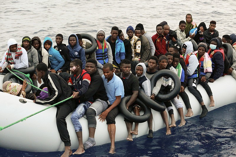 FILE - Migrants are brought to shore after being intercepted by the Libyan coast guard on the Mediterranean Sea, in Garaboli Libya, on Oct. 18, 2021. A confidential European Union military report calls for the continued support and training of Libya’s coastguard and navy despite concerns about their treatment of migrants, a mounting death toll at sea, and the continued lack of any central authority in the North African nation. The report circulated to EU officials on Jan. 4 and obtained by The Associated Press offers a rare insight into Europe’s determination to cooperate with Libya and its role in the interception and return of thousands of men, women and children to a country where they face insufferable abuse. (AP Photo/Yousef Murad, File)