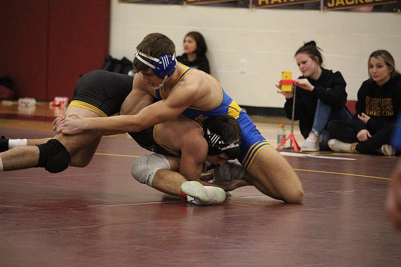 Lakeside and Lake Hamilton wrestlers battle for control at Lake Hamilton Middle School Tuesday night. The Wolves came away with a 61-17 win over the Rams. - Photo by Krishnan Collins of The Sentinel-Record