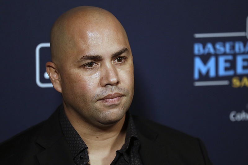 FILE - New York Mets manager Carlos Beltran listens to a question during the Major League Baseball winter meetings, Tuesday, Dec. 10, 2019, in San Diego. With Barry Bonds, Roger Clemens and Curt Schilling off the ballot, next year&#x2019;s Hall of Fame vote figures to be a bit less contentious. Then again, the top newcomer arrives with his own recent baggage. Carlos Beltr&#xe1;n is eligible for the Hall of Fame in 2023, and although the sweet-swinging outfielder had a distinguished career at the plate and in the field, he was also implicated in the Houston Astros&#x2019; sign-stealing scandal. (AP Photo/Gregory Bull, File)