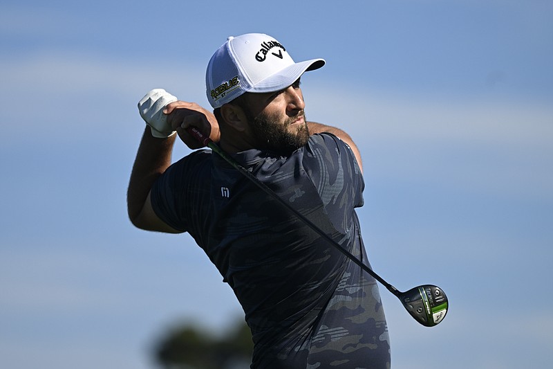 Jon Rahm of Spain hits his tee shot on the second hole of the South Course at Torrey Pines during the first round of the Farmers Insurance Open golf tournament, Wednesday, Jan. 26, 2022, in San Diego. (AP Photo/Denis Poroy)