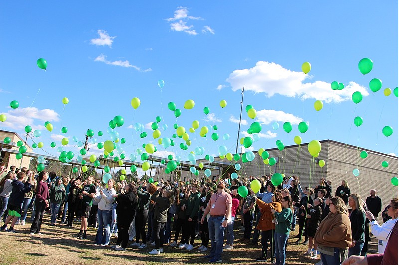 Students and staff at Redwater Junior High released green balloons Friday in memory of student Micah Franco. Micah, 13, died late Tuesday at his home of suspected carbon monoxide poisoning. Green was Micah’s favorite color, so the balloons were all different shades of green. His family, including his sister, who was also recovering from carbon monoxide poisoning, were able to attend for the release, according to the school district. (Photo courtesy of Redwater School District)