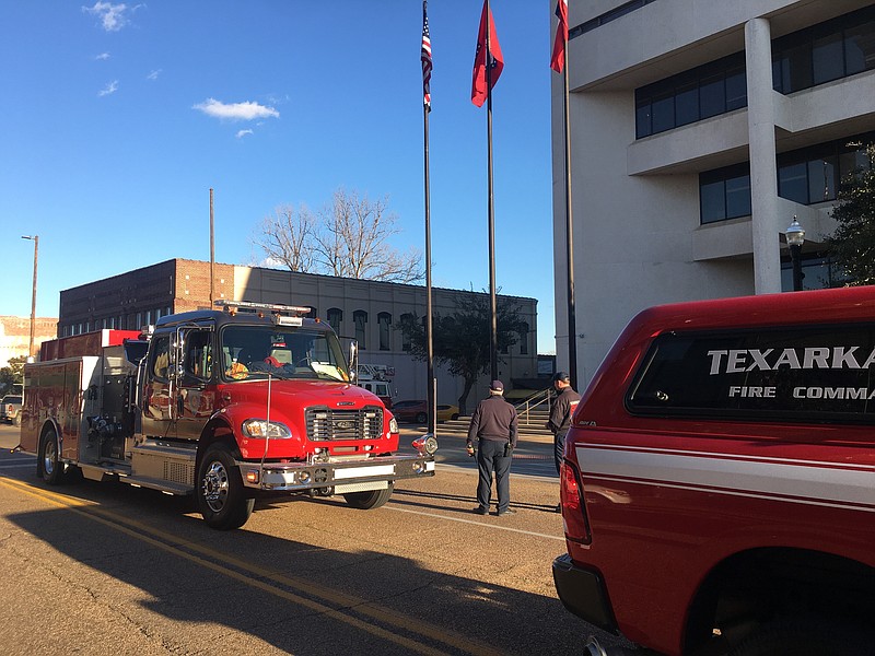 About five fire units responded to an alarm at the Bi-State Justice Building around 4:30 p.m. Friday in downtown Texarkana. An inmate had set a small paper fire that caused a great deal of smoke that had to be flushed out. An hour later, the units had all returned to their stations. (Staff photo by Les Minor)