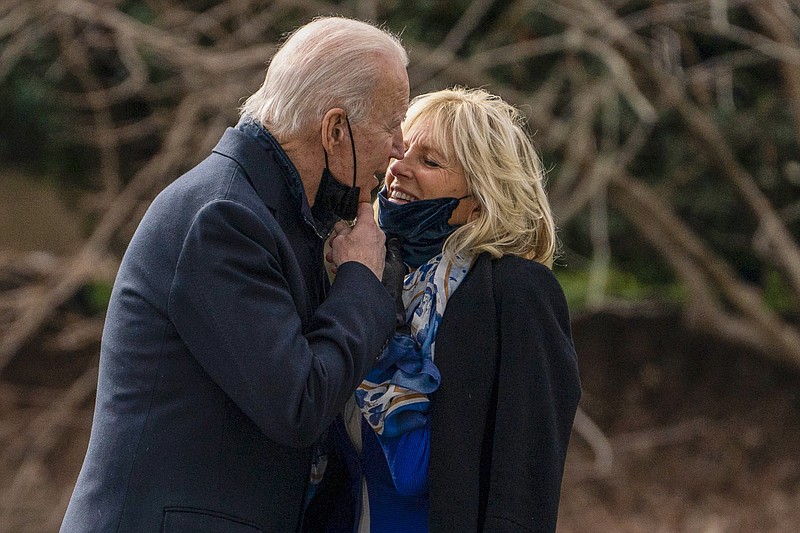 FILE - President Joe Biden kisses first lady Jill Biden before boarding Marine One to visit wounded troops at Walter Reed National Military Medical Center, on the South Lawn of the White House, on Jan. 29, 2021, in Washington. (AP Photo/Evan Vucci, File)