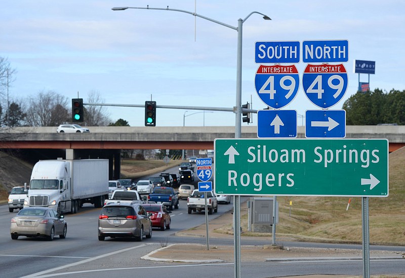 Traffic passes Friday, Jan. 28, 2022, along Sunset Avenue near the highway's exchange with Interstate 49 in Springdale. A 189-mile portion of U.S. 412 in Arkansas and Oklahoma has been officially designated a future Interstate on the National Highway System. Visit nwaonline.com/220130Daily/ for today's photo gallery.
(NWA Democrat-Gazette/Andy Shupe)