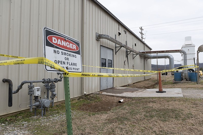 The building where the biosolids dryer for the city of Fayetteville exploded is seen Thursday, Jan. 27, 2022, with holes and damage at the biosolids management site building on Wyman Road. The city&#xed;s biosolids dryer had a catastrophic failure in December, prompting the city to temporarily haul the materials to the landfill until an alternative drying method is installed. (NWA Democrat-Gazette/Spencer Tirey)