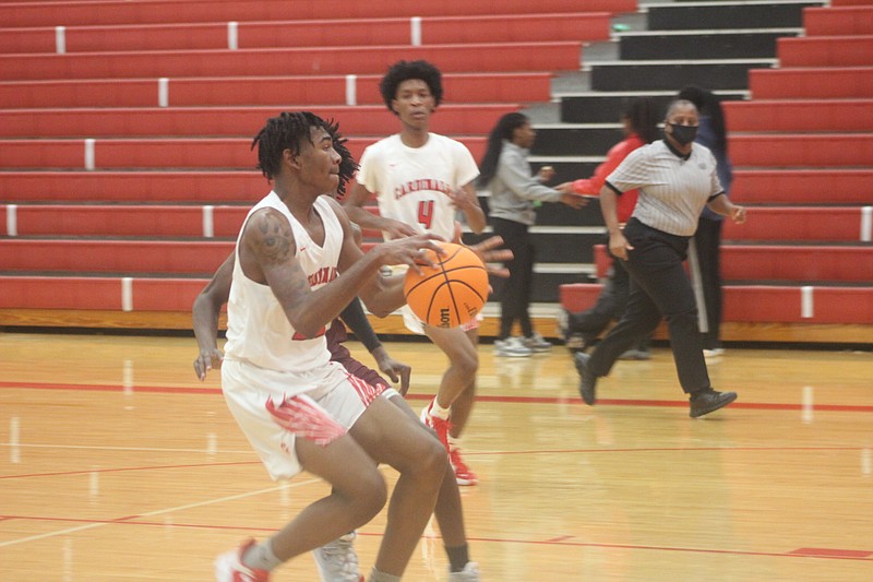 Jalen Dandridge looks to convert on a fast break in the first half. The Cardinals defeated the Crossett Eagles Saturday afternoon for their 11th win of the season. - Photo by Patric Flannigan