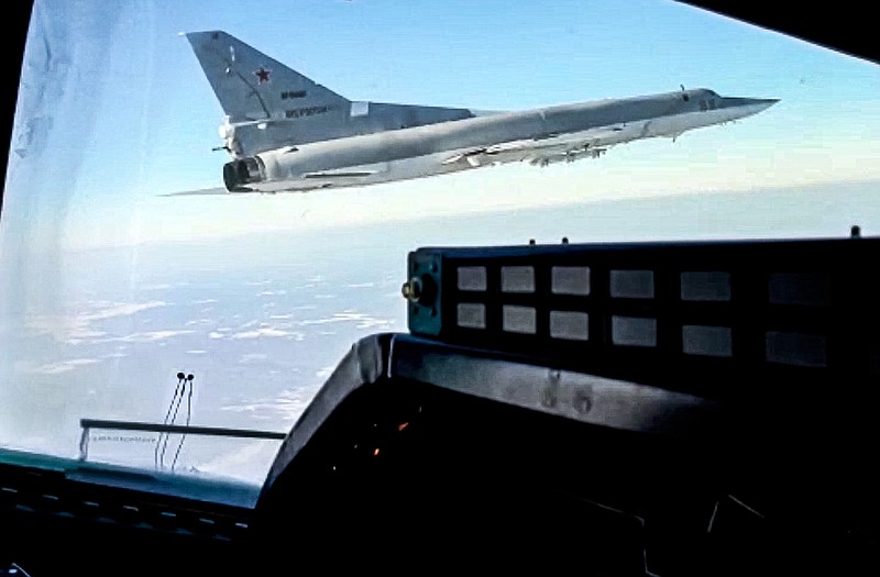 In this photo taken from video and released by the Russian Defense Ministry Press Service on Saturday, Feb. 5, 2022, A view of a  Tu-22M3 bomber of the Russian air force seen from the cockpit of another such plane during a training flight. Two Tu-22M3 long-range bombers of the Russian air force performed a patrol mission over Belarus on Saturday amid the tensions over Ukraine. (Russian Defense Ministry Press Service via AP)