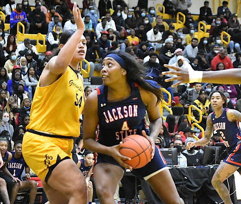 Ameshya Williams-Holliday of Jackson State maneuvers against Maya Peat of UAPB in the paint in the second half Monday, Feb. 7, 2022, at H.O. Clemmons Arena. (Pine Bluff Commercial/I.C. Murrell)
