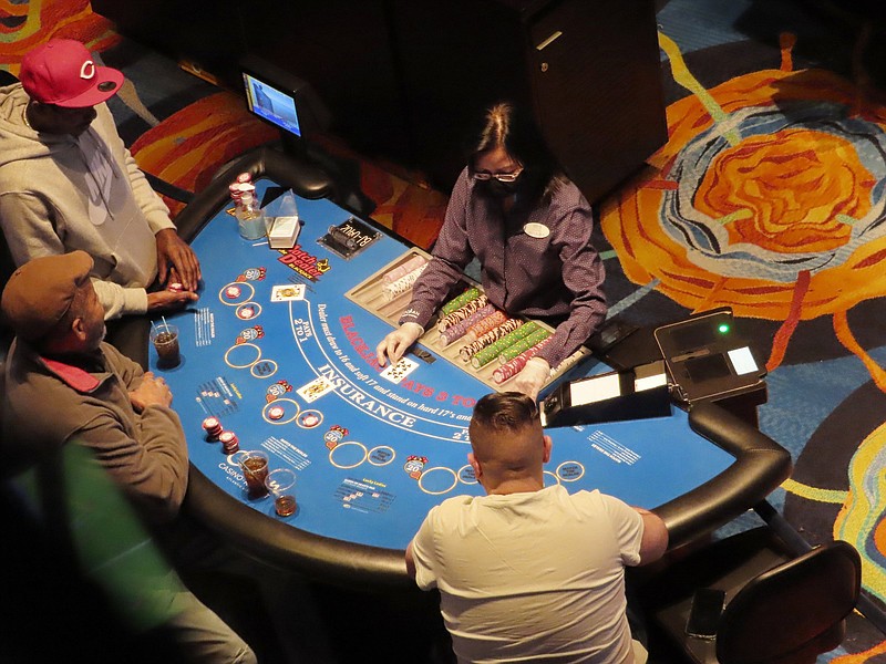 A card game is under way at the Ocean Casino Resort on Feb. 10, in Atlantic City N.J. The American Gaming Association released figures Tuesday showing that U.S. commercial casinos won $53 billion in 2021, making it the gambling industry's best year ever.

(AP/Wayne Parry)