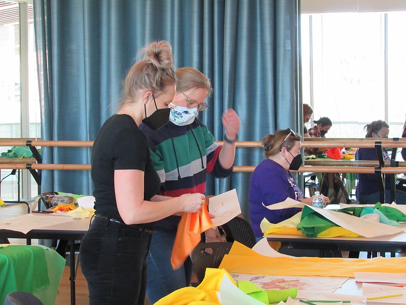 Lorenzen works with a participant in one of the Create and Collaborate workshops that she led this winter at the Fayetteville Public Library.

(Courtesy photo)