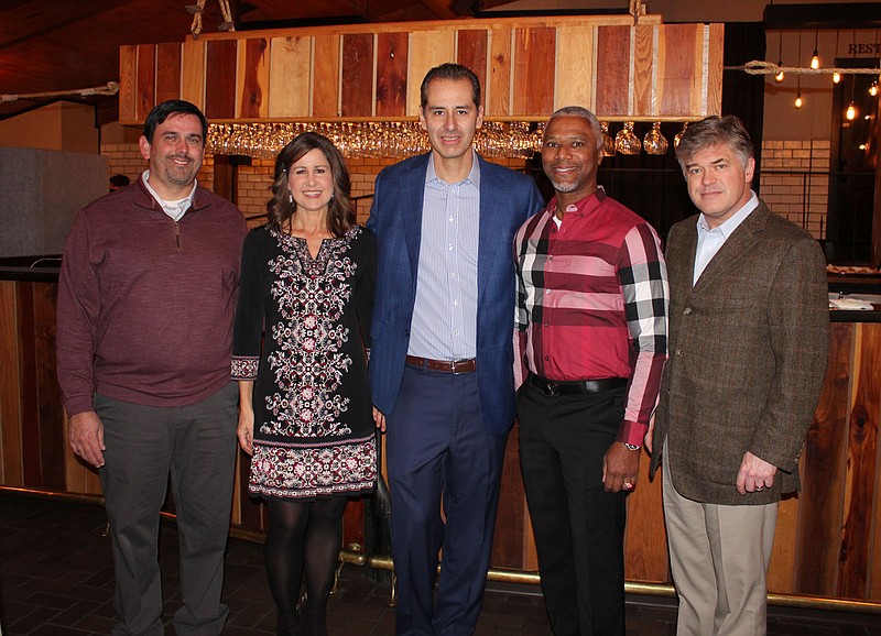 James and Angie Graves (from left), Pat O'Brien, Marcus Pinkney and Jason Hurt, Jackson L. Graves Foundation board members, welcome guests to Ooh! la, la! on Feb. 10 at The Garden Room in Fayetteville.
(NWA Democrat-Gazette/Carin Schoppmeyer)